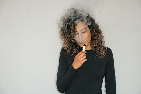 A Woman using Vape